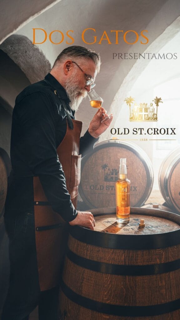 A man smelling on a rum tasting glass. Dos Gatos is presenting Old St Croix products
